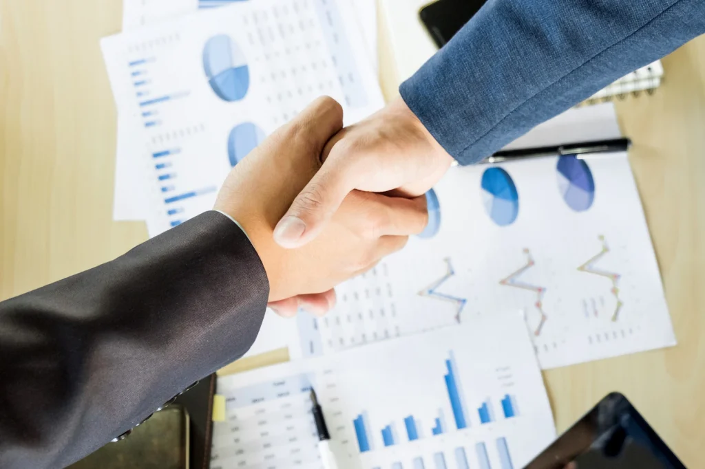 businessmen-shaking-hands-during-meeting